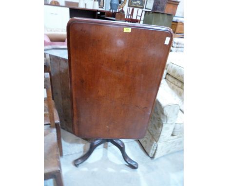 A 19th century mahogany snap-top table, the moulded oblong top on turned column and tripod support. 36' wide