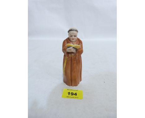 A Royal Worcester candle snuffer, monk with bible. 1919