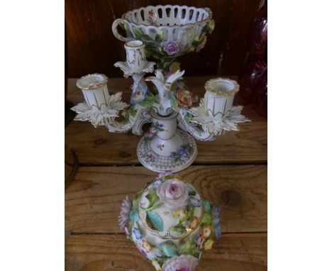 A collection of floral encrusted ceramics to include a Continental centrepiece, a Dresden candelabra (af), a similar candlest