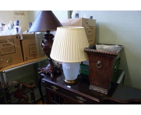 A reproduction painted metal twin handled table lamp together with a frosted glass table lamp (sold electrically untested).