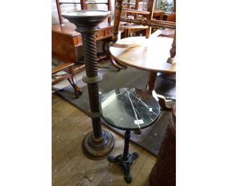 A marble topped tripod table, raised on cast metal plinth base, together with a 20th Century oak torchere