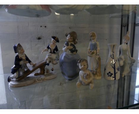 A mixed lot of Nao and other figurines and a blue and white vase (6)