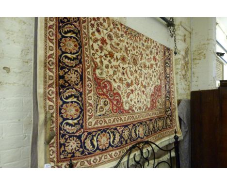 A Keshan carpet, on a beige ground, 2.80x2.0m