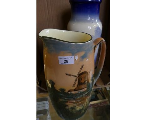 A large Royal Doulton wash jug decorated with a windmill scene pattern no. 3394, together with a further Doulton vase decorat