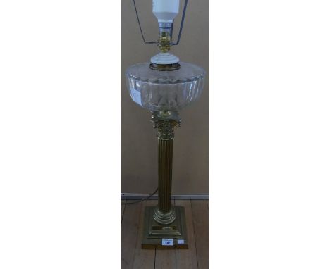 A brass Corinthian column table lamp, formed from a converted well lamp (sold electrically untested)