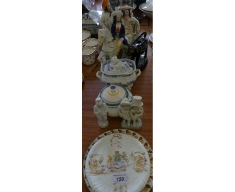 A mixed lot comprising Staffordshire figure group, Staffordshire cow creamer, blue and white sauce tureen, Poole Pottery powd