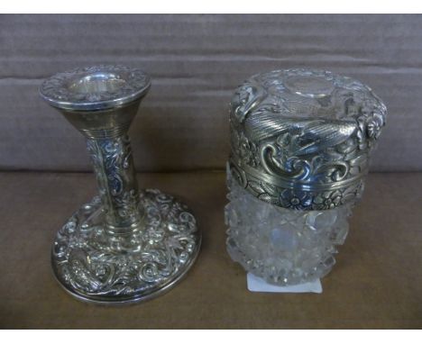 A mixed lot comprising a cut glass silver topped dressing table jar with foliate decoration together with a further weighted 