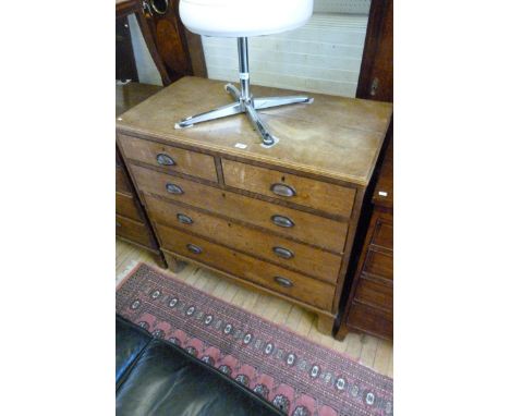 A Georgian light oak chest of two short over three long drawers, raised on bracket supports, with replacement handles.