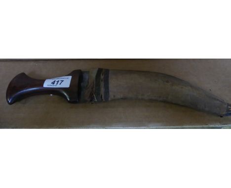 An Arab Jambiya knife, early 20th Century 21cm curved double edged blade, with wooden grip, complete with velvet covered wood