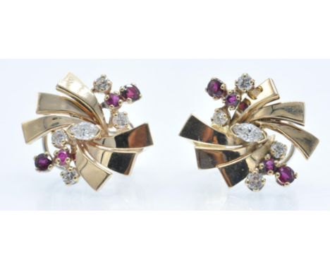 A pair of 14ct gold ruby and diamond earrings. The earring of starburst design, set with marquise and round brilliant diamond