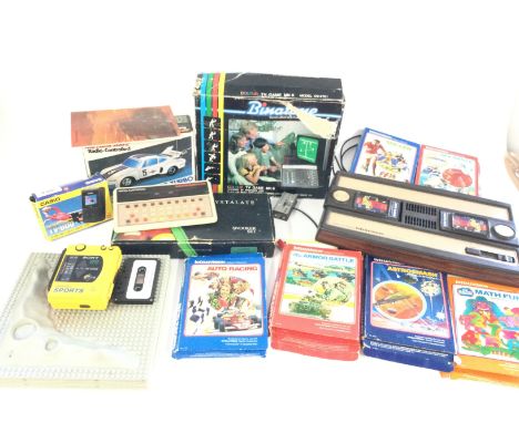 A box containing a Mattel Intellivision plus 6 games, also a Mattel Brain Baffler, a Sony Walkman Sports, a boxed Binatone co