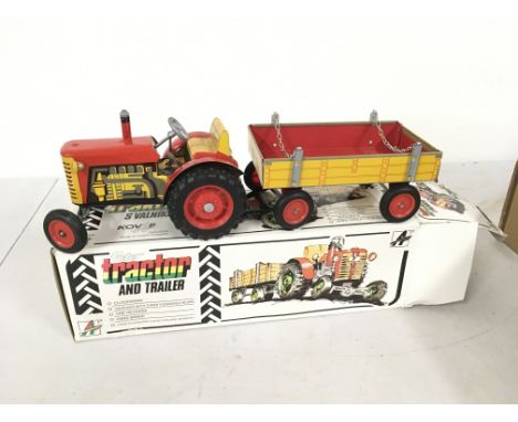 A boxed Fetor clockwork Tractor and Trailer . No key. No reserve