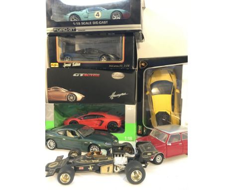 A Color Boxed And Loose Diecast Cars 1/18 Scale. Some Cars Damaged.