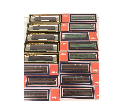 A Collection of Boxed 00 Gauge Coaches and Car Loaders by Bachmann and Llima.