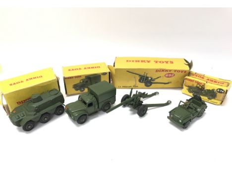 4 Boxed Dinky Military Vehicles. A Armoured Personnel Carrier #676. A Army 1-ton Cargo Truck #641. A 5.5 Medium Gun And A Aus