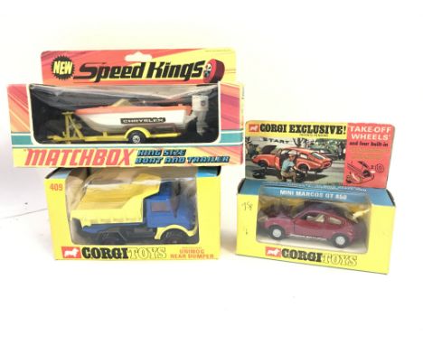 A Boxed Corgi Unimog Rear Dumper #409. A Mini Marcos GT 850 and a Matchbox King Size Boat And Trailer #K-25.