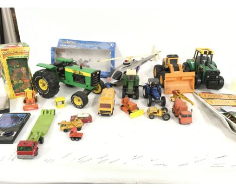 A box containing a mixed collection of Playworn diecast and plastic model vehicles by Tonka ..Buddy L and others. Also includ