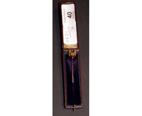 Gold-coloured tie pin with a fox's head