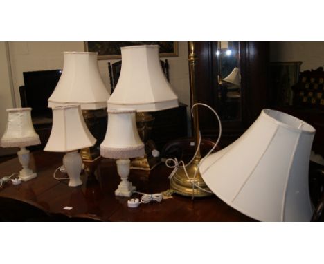 A large modern standard lamp, two medium lamps, plus three small lamps
