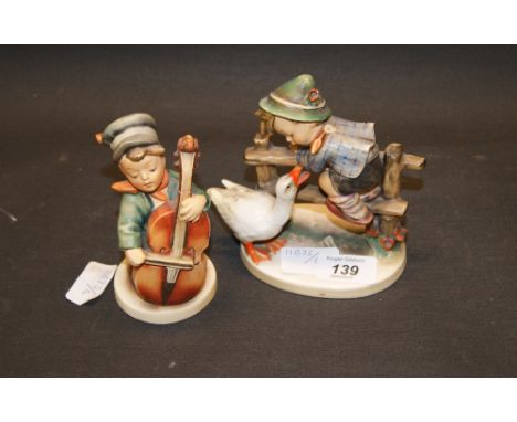 Goebel figure of a young boy and a geese plus another figure of a young boy playing the cello A/F