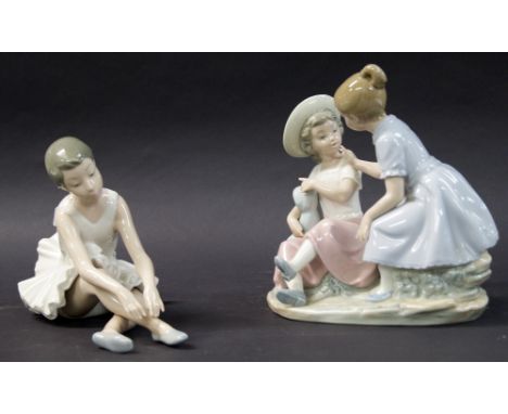 A Nao group figure of two girls in conversation, plus a seated ballerina