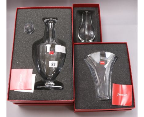 A Baccarat decanter and two vases, all cased decanter height 34.5cm