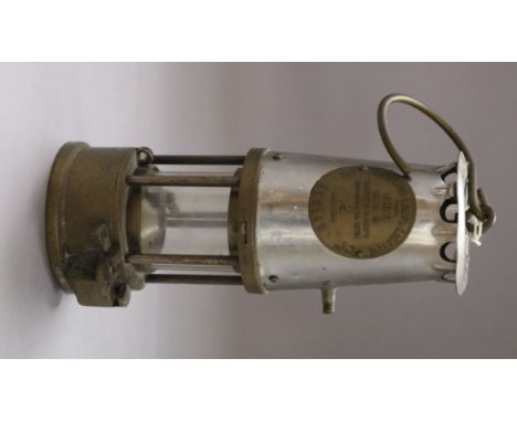 A miner's lamp by the Protector Lamp and Lighting Co Ltd overall height 31cm