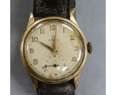 A gentleman's early 1940's 9ct gold Omega manual wind wrist watch.