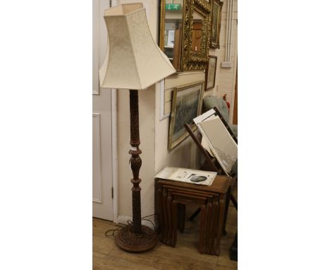 A carved standard lamp and carved set of four graduated side tables tables W.51cm, lamp W.35cm at base