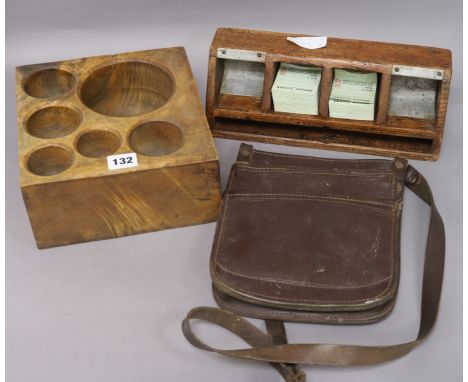 A wooden money scoop, a ticket and money tray and leather bus man's bag