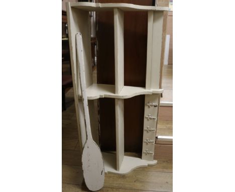 A painted wall shelf with hooks and paddle Shelf W.123cm