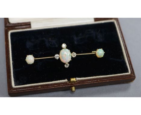 An early 20th century yellow metal, white opal and diamond set bar brooch, 50mm.