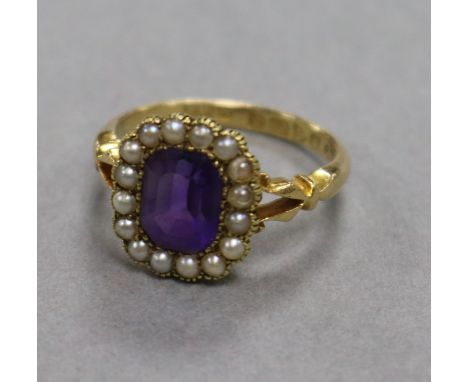 An early 20th century 18ct gold, amethyst and seed pearl dress ring, size M/N.