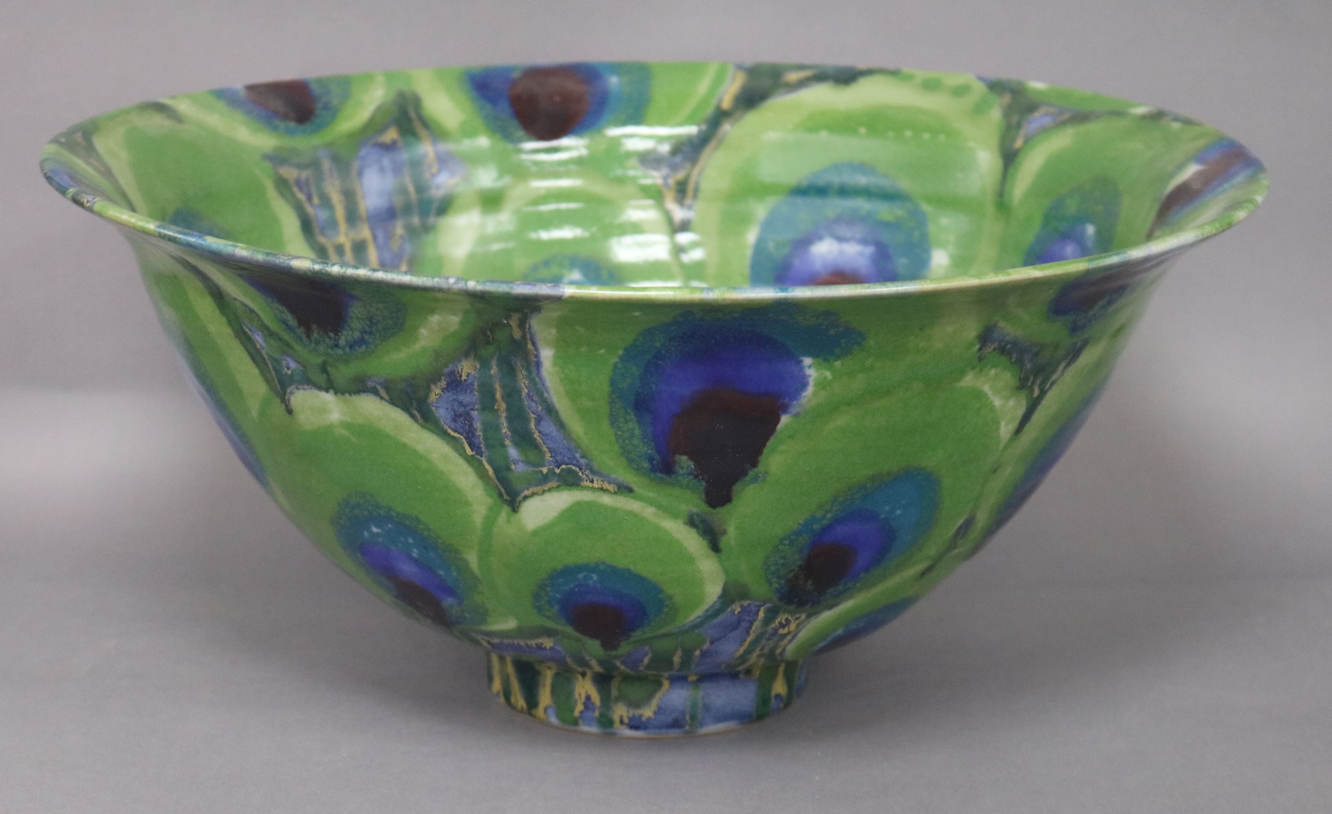 A Dartington Pottery 'Peacock' design large bowl by Janice Tchalenko