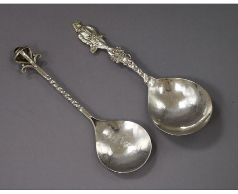 An Arts and Crafts silver caddy spoon with cabochon terminal and a Dutch imported silver spoon.