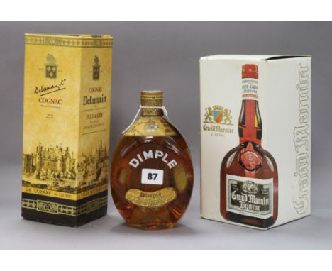 Three bottles: Delmaine Cognac (boxed), Dimple Haig blended whisky and Grand Marnier