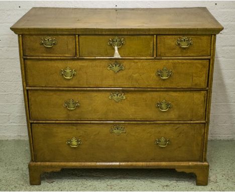 CHEST, Queen Anne walnut of three short and three long drawers on bracket feet, 93cm H x 105cm Wx 54cm D. 