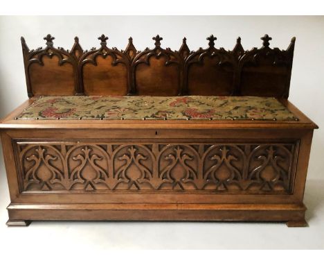 HALL BENCH, mid 19th century walnut with carved arched panelled trefoil crests and original tapestry cover to rising lid/seat