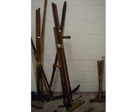 Bundle of various tools to include a scythe, various hoe's etc