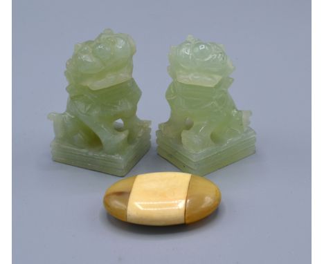 A Pair Of Chinese Jade Carved Models in the form of fou dogs 6 cms tall together with a horn and bone paperweight 