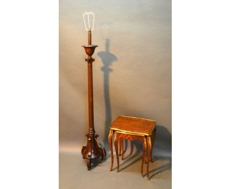 A Mahogany Lamp Standard of Corinthian form together with a nest of two French style occasional tables 