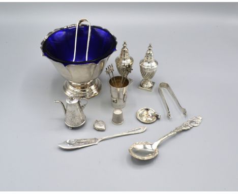 A Birmingham Silver Miniature Chamber Stick together with a Sheffield silver butter knife, a silver locket of heart form, a 9