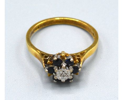 An 18ct. Gold Diamond and Sapphire Cluster Ring, ring size O, 3.5 gms. 