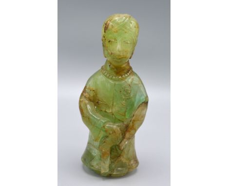 A Chinese Jade Carving Of Figural Form 20 cms tall 