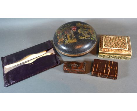 A 19th Century Lacquered Snuff Box together with three other boxes and two brushes within leather case 