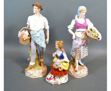 A Pair of Late 19th century German porcelain figures "The Flower Sellers" 22cm tall together with another similar smaller 