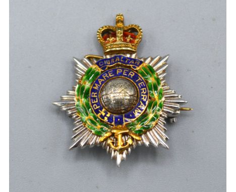 A 9ct Gold brooch, Royal Marines Gibraltar with enamel decoration, 7.6 gms, 3 x 2.5 cms 