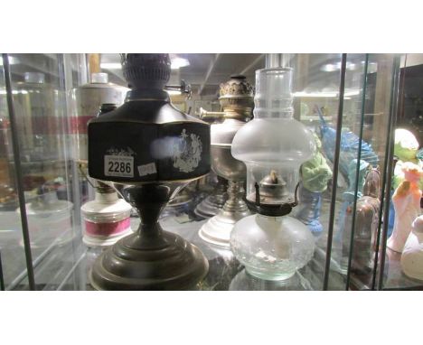 Four old oil lamp bases.
