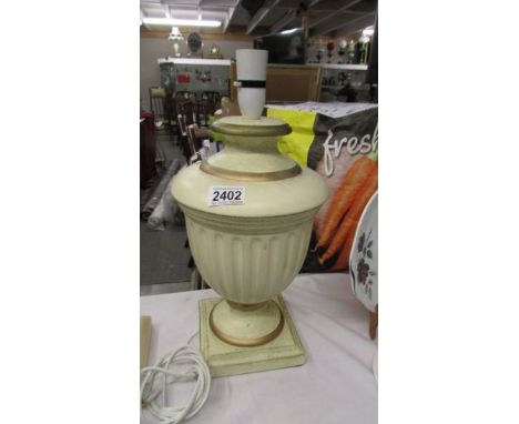 A table lamp base in the shape of an urn.