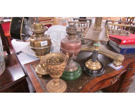 2 oil lamp bases with burners and 2 other lamp bases.